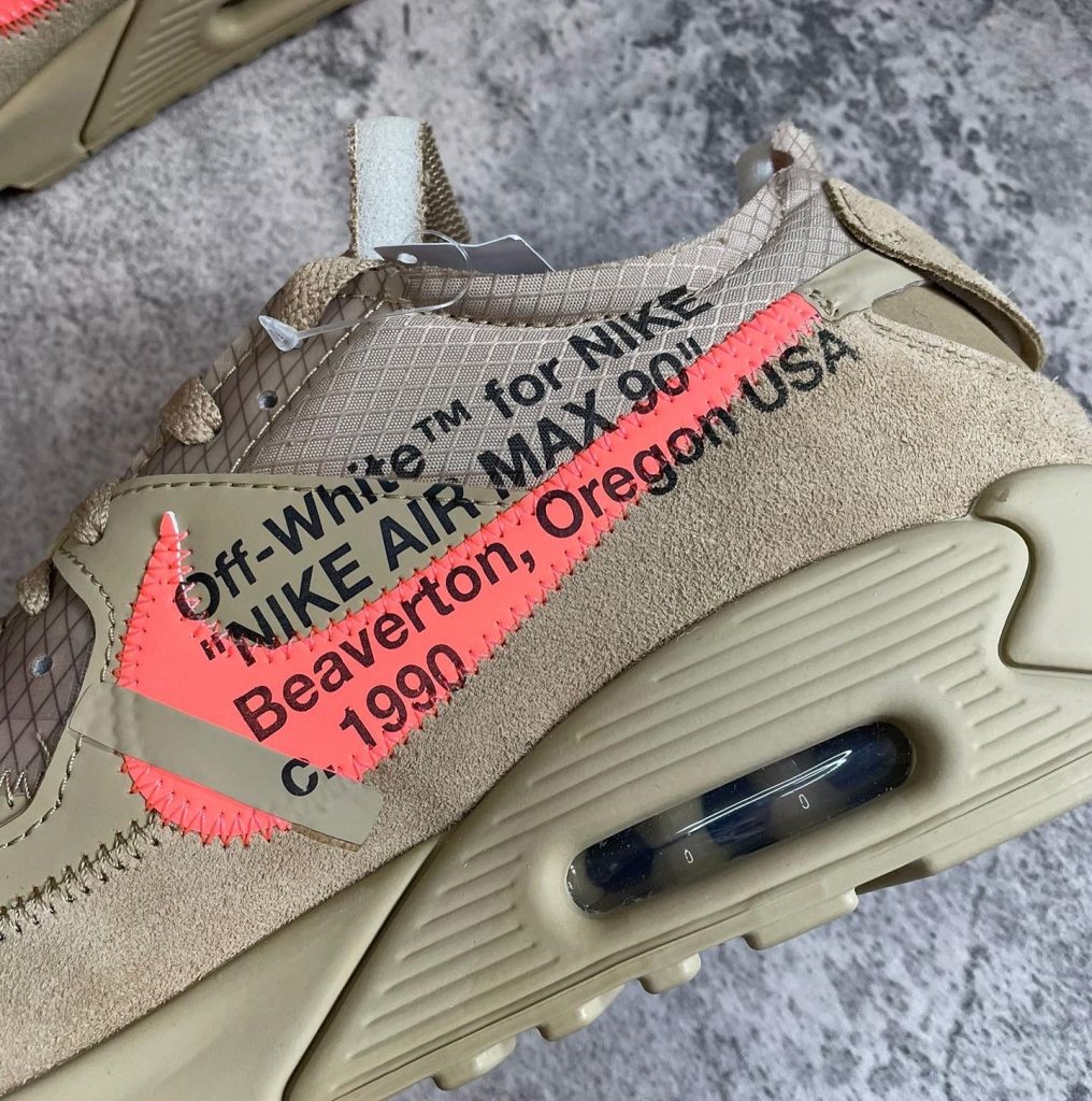 Off White x Nike Air Max 90 Desert Ore side profile with orange tab and exposed text branding