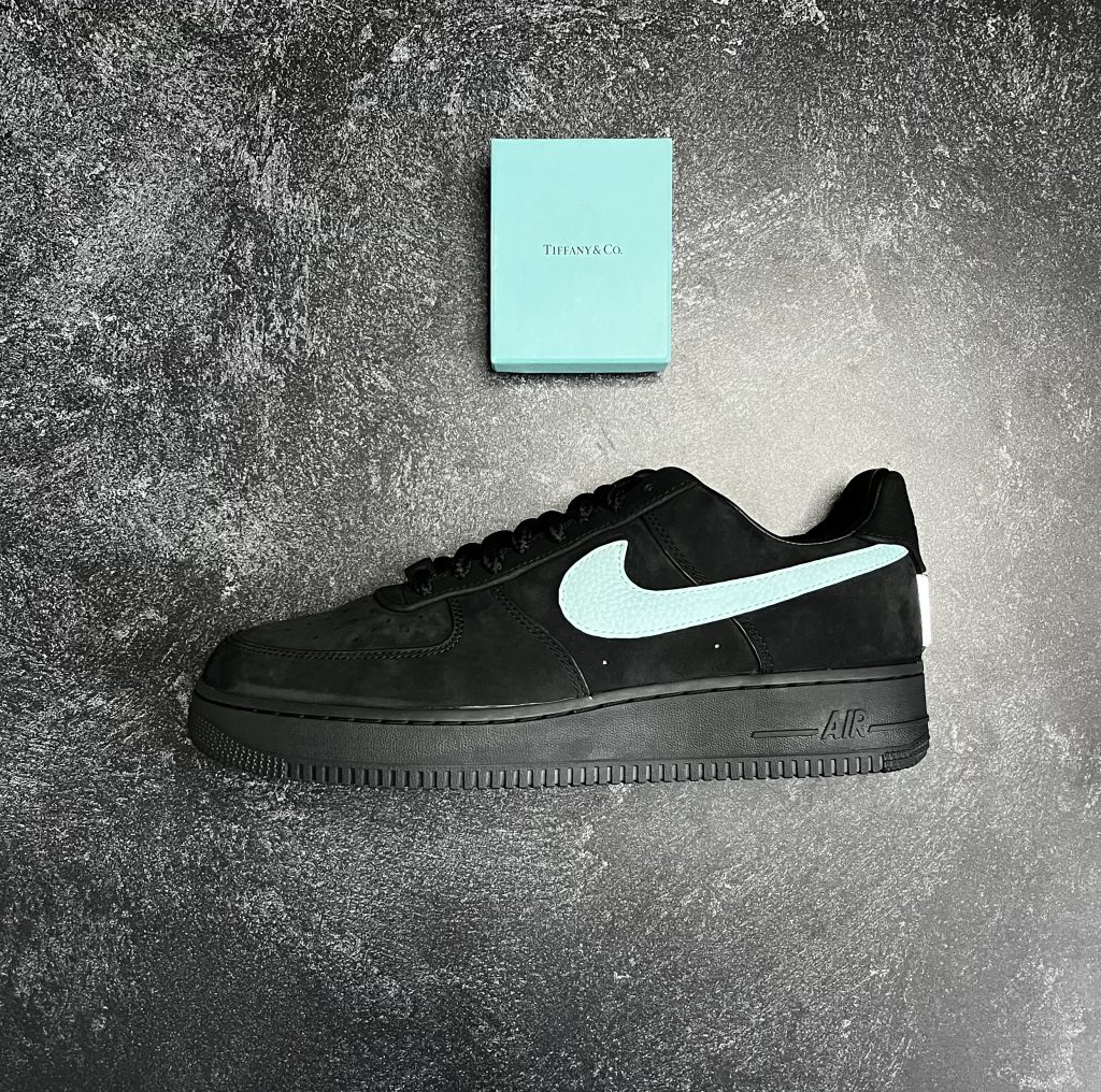 Side profile of the Nike Air Force 1 x Tiffany & Co. in black suede