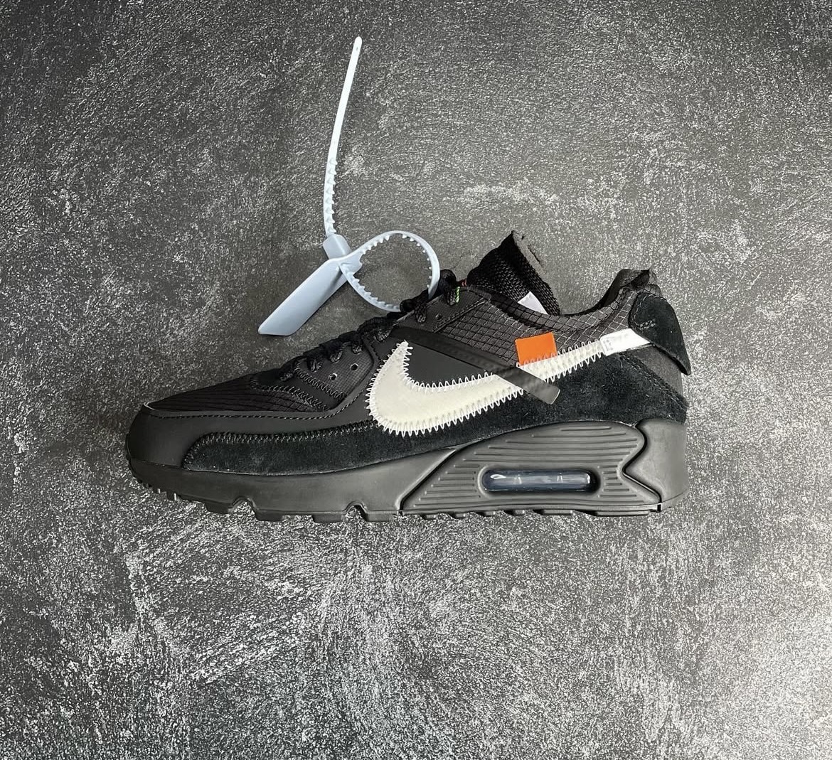 Off White x Nike Air Max 90 black with white Swoosh and exposed zip tie detail
