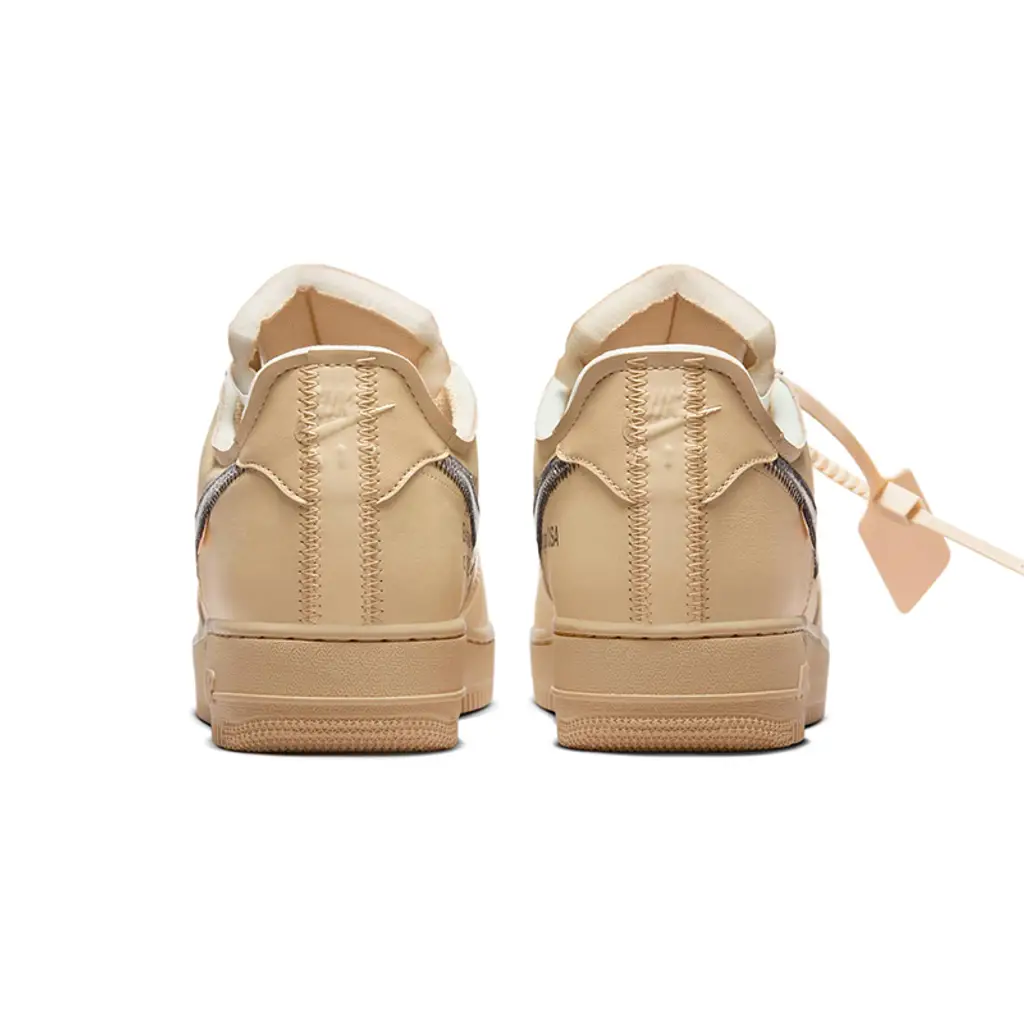 Rear heel view of the Off-White x Nike Air Force 1 Low Sesame highlighting beige leather construction and minimalist heel tab design.